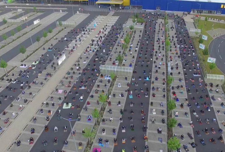 Extraordinary moment Muslims gather in Ikea car park to celebrate Eid while social distancing